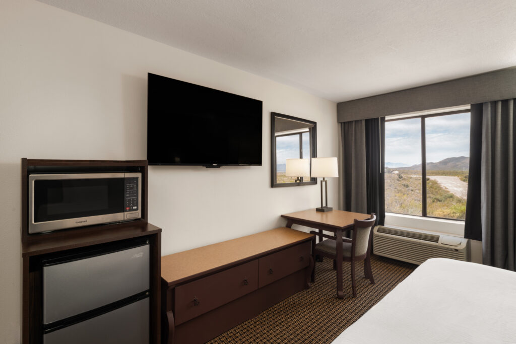 Accessible king guest room desk and television