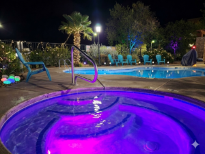 Hotel pool and hot tub at night